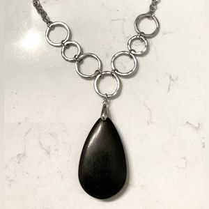 Beautiful almond shaped natural black stone pendant with silver chain necklace.